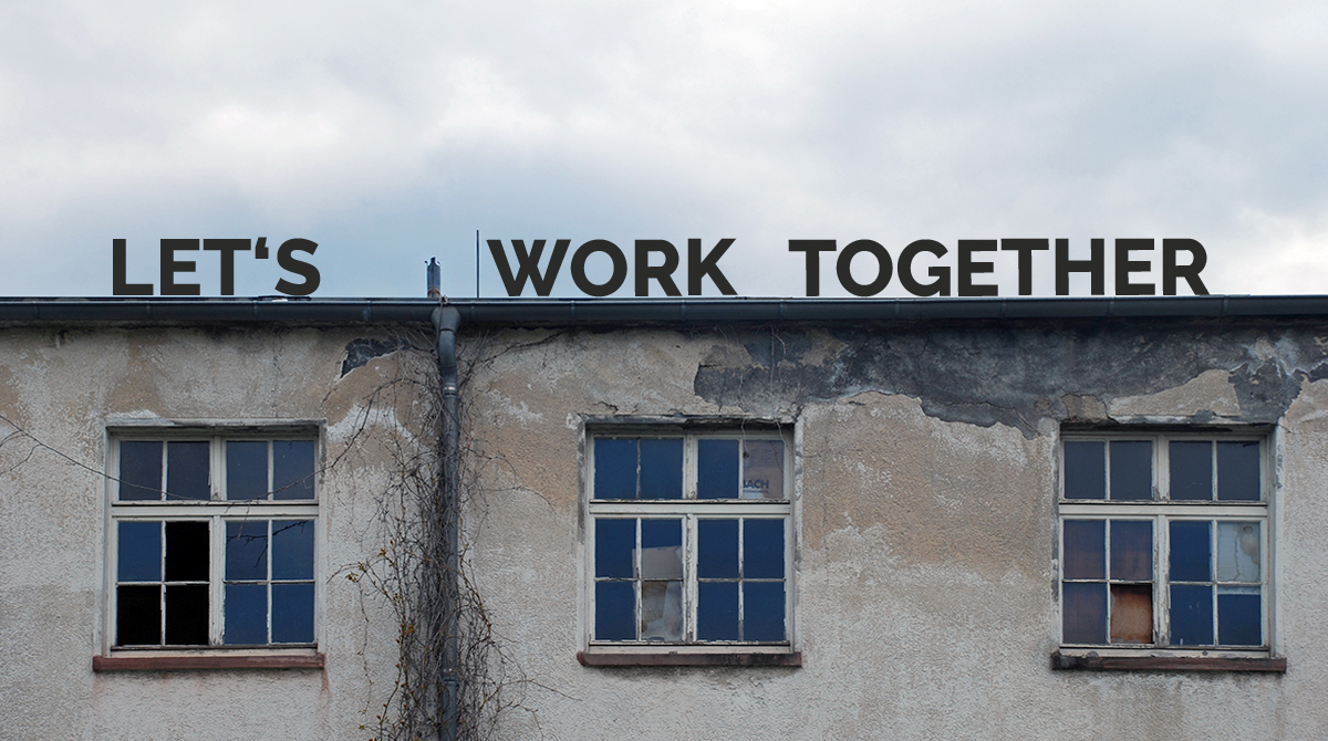 Let's Work Together - Schild auf einem alten Gebäude